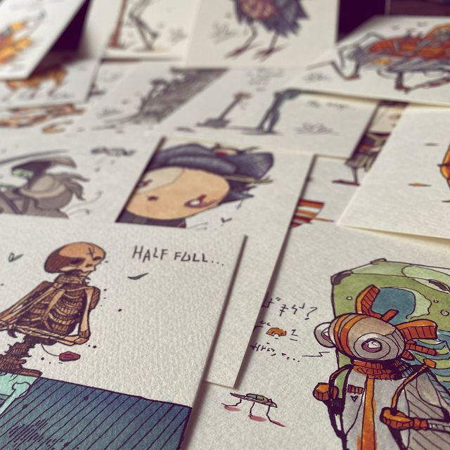 Spread of loose sketches and character studies on a desk