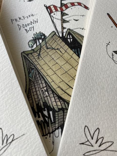 Sketchbook page: crooked house with banner flags